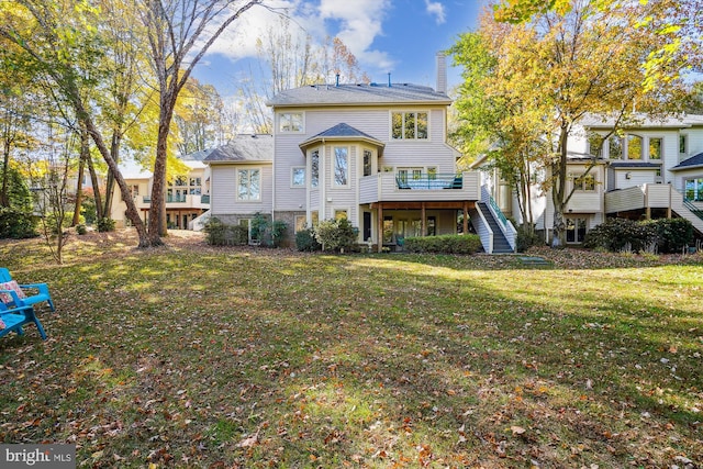 1145 Water Pointe Ln, Reston, VA 20194 - rear view of house featuring stairs, a chimney, a deck, and a yard