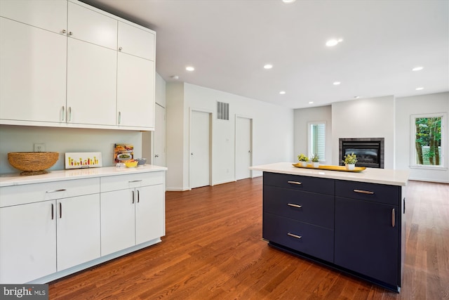 1145 Water Pointe Ln, Reston, VA 20194 - kitchen featuring light countertops, plenty of natural light, white cabinets, dark wood-type flooring, and recessed lighting