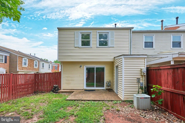 8321 Irongate Way, Manassas, VA 20109 - back of house featuring central AC unit, a fenced backyard, and a patio
