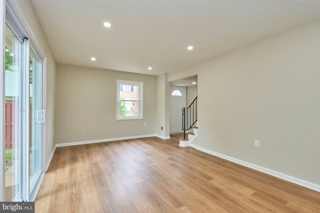 8321 Irongate Way, Manassas, VA 20109 - empty room featuring stairs, light wood-type flooring, baseboards, and recessed lighting