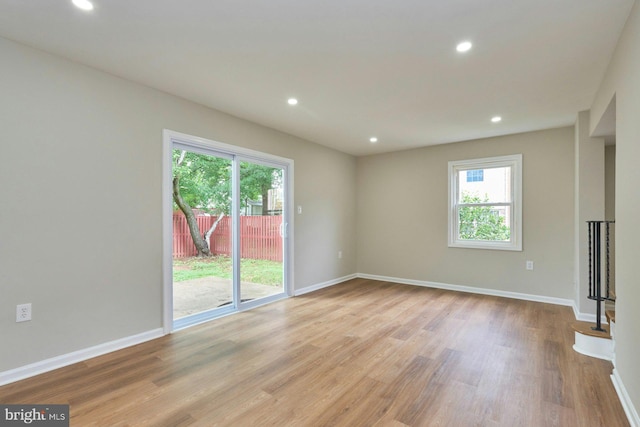 8321 Irongate Way, Manassas, VA 20109 - unfurnished living room with light wood-style flooring, healthy amount of natural light, recessed lighting, and baseboards