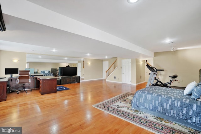 bedroom featuring baseboards and light wood-style floors