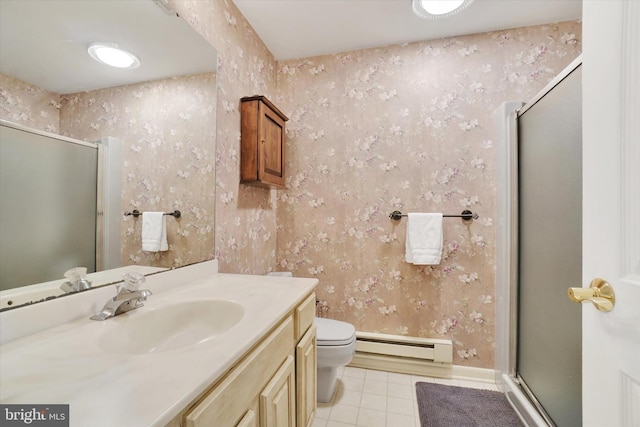 bathroom with a shower stall, vanity, tile patterned floors, a baseboard radiator, and toilet
