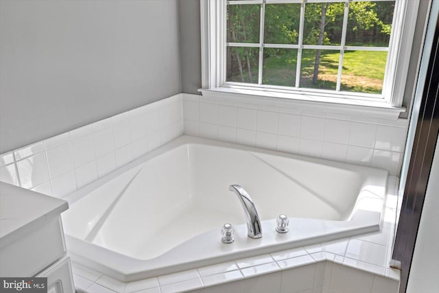 bathroom with a garden tub