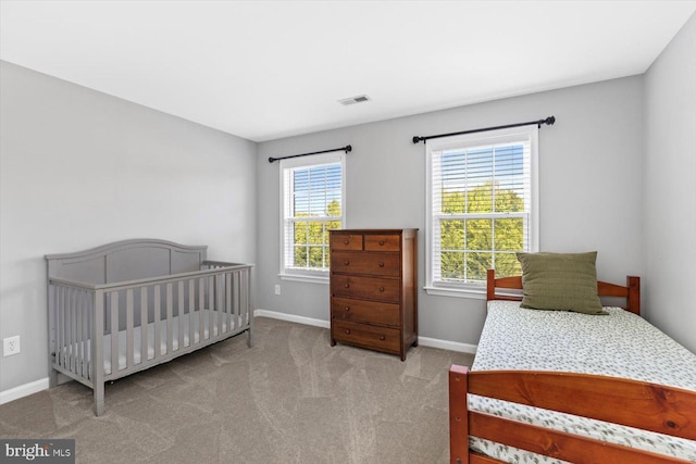 carpeted bedroom with baseboards