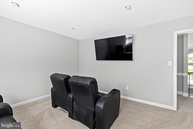 carpeted cinema with baseboards