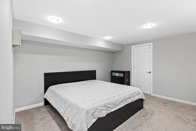 bedroom featuring carpet flooring and baseboards