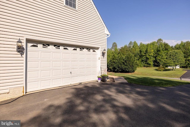 garage with asphalt driveway