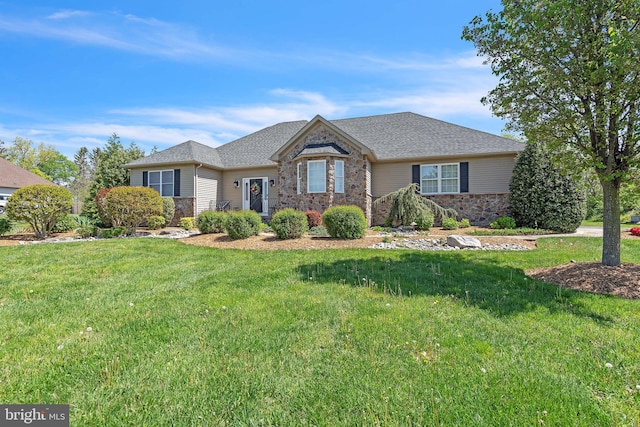 ranch-style home with roof with shingles, stone siding, and a front yard