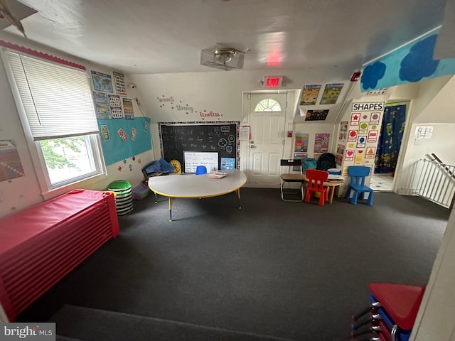 rec room featuring carpet flooring