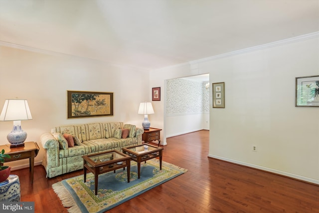 living room with crown molding, baseboards, and hardwood / wood-style flooring