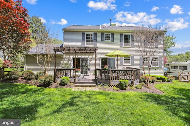 back of house featuring a yard, a pergola, and a deck