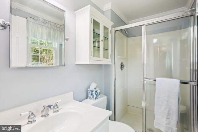 full bath featuring vanity, ornamental molding, a stall shower, and toilet