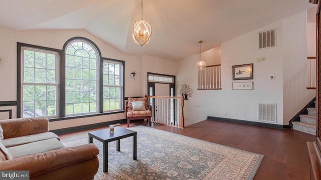 11400 Rolling Green Pl, Hagerstown, MD 21742 - living area with vaulted ceiling, an inviting chandelier, visible vents, and dark wood-type flooring