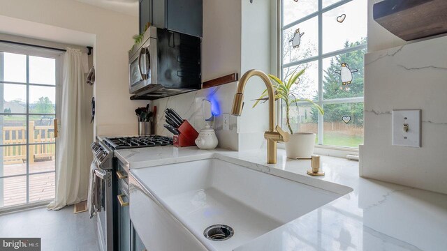 11400 Rolling Green Pl, Hagerstown, MD 21742 - room details with stainless steel appliances, a sink, and light stone countertops