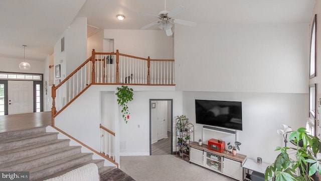 11400 Rolling Green Pl, Hagerstown, MD 21742 - living room featuring ceiling fan, stairs, high vaulted ceiling, and visible vents