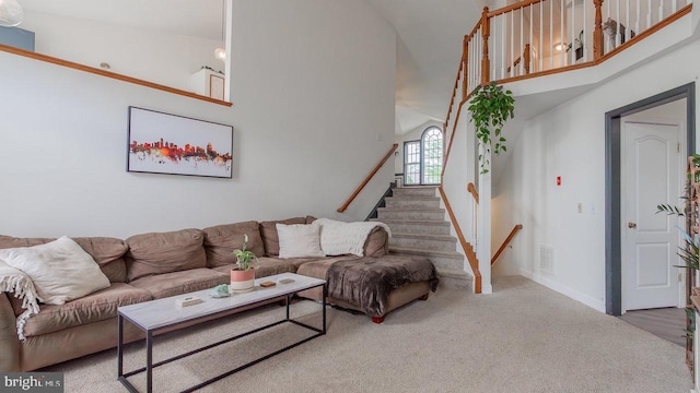 11400 Rolling Green Pl, Hagerstown, MD 21742 - living area with visible vents, stairway, carpet flooring, a high ceiling, and baseboards