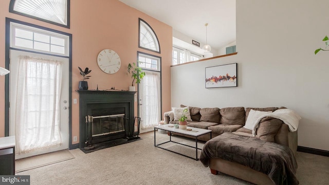 11400 Rolling Green Pl, Hagerstown, MD 21742 - living room with baseboards, carpet flooring, a fireplace with flush hearth, and high vaulted ceiling