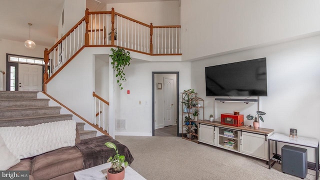 11400 Rolling Green Pl, Hagerstown, MD 21742 - living room with stairs, high vaulted ceiling, visible vents, carpet flooring, and baseboards