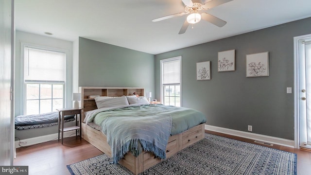 11400 Rolling Green Pl, Hagerstown, MD 21742 - bedroom featuring baseboards, multiple windows, ceiling fan, and wood finished floors