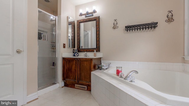 11400 Rolling Green Pl, Hagerstown, MD 21742 - bathroom with tile patterned floors, a garden tub, visible vents, and a stall shower
