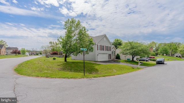11400 Rolling Green Pl, Hagerstown, MD 21742 - view of home's exterior featuring a lawn, a garage, a residential view, and driveway