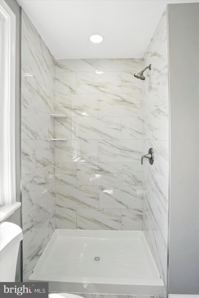 bathroom with recessed lighting and a stall shower