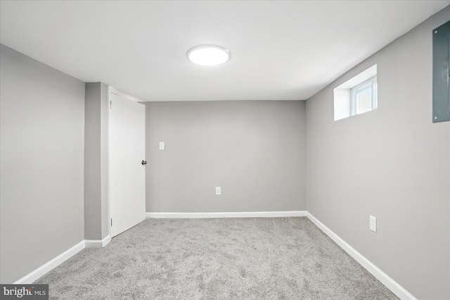 basement featuring baseboards and carpet