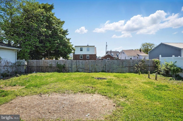view of yard with fence and a residential view