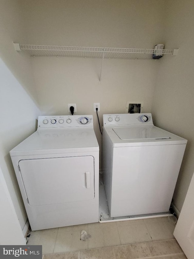 12001 Market St Unit 159, Reston, VA 20190 - laundry room with washer and clothes dryer and laundry area