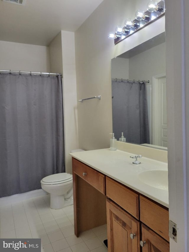 12001 Market St Unit 159, Reston, VA 20190 - full bathroom with vanity, toilet, and tile patterned floors