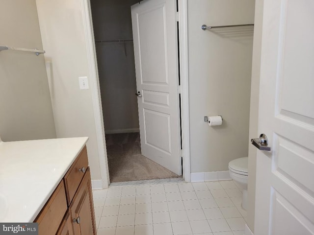 12001 Market St Unit 159, Reston, VA 20190 - bathroom featuring vanity, toilet, and baseboards