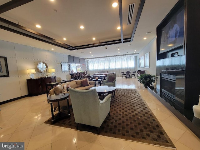 12001 Market St Unit 159, Reston, VA 20190 - living area with a tray ceiling, visible vents, light tile patterned flooring, and recessed lighting