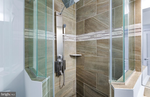 full bathroom with tiled shower