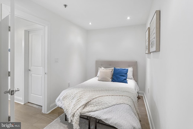 bedroom with baseboards and recessed lighting