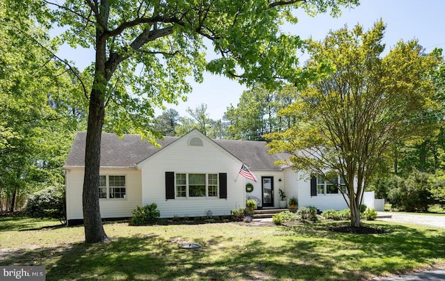 106 Boundary, Saint Michaels, MD 21663 - view of front of house featuring roof with shingles and a front yard