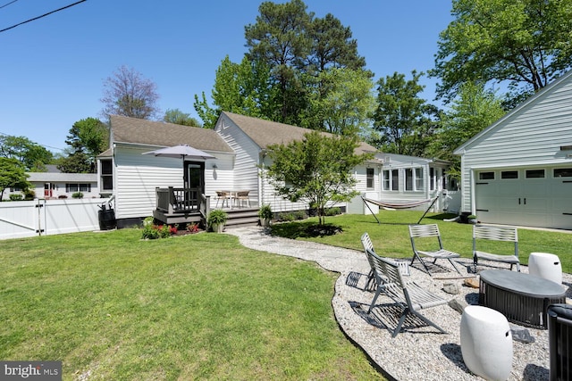 106 Boundary, Saint Michaels, MD 21663 - rear view of property featuring a yard, a deck, fence, and a gate