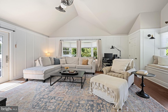 106 Boundary, Saint Michaels, MD 21663 - living room with wood finished floors, lofted ceiling, a decorative wall, and a wealth of natural light