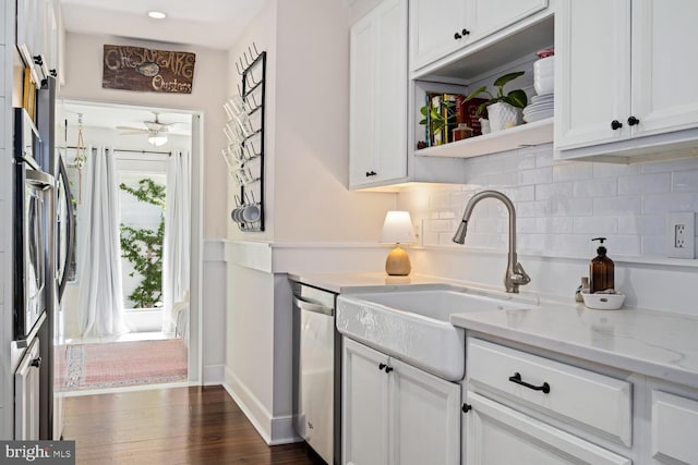 106 Boundary, Saint Michaels, MD 21663 - kitchen featuring a ceiling fan, tasteful backsplash, stainless steel dishwasher, a sink, and white cabinets