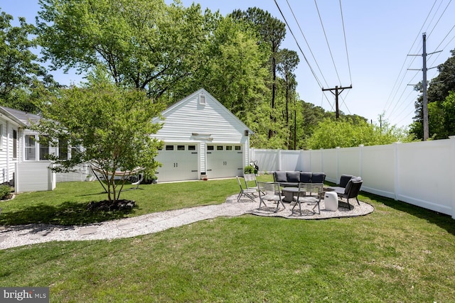 106 Boundary, Saint Michaels, MD 21663 - view of yard with a detached garage, outdoor lounge area, a fenced backyard, an outbuilding, and a patio