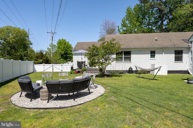 106 Boundary, Saint Michaels, MD 21663 - rear view of property featuring a fenced backyard, roof with shingles, a lawn, and outdoor lounge area