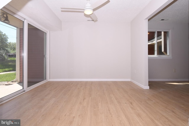 unfurnished room featuring baseboards, ceiling fan, and wood finished floors