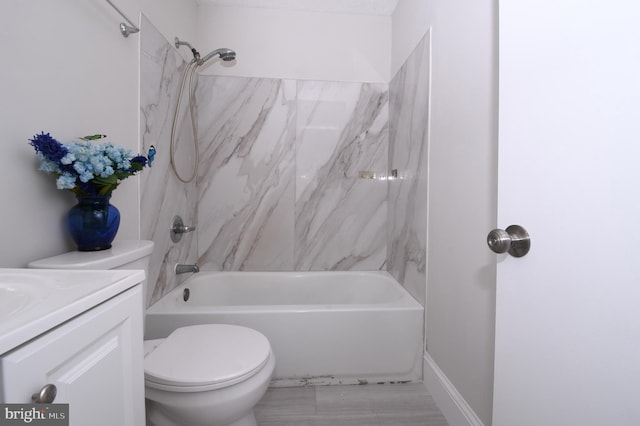 bathroom featuring vanity, toilet, and shower / washtub combination