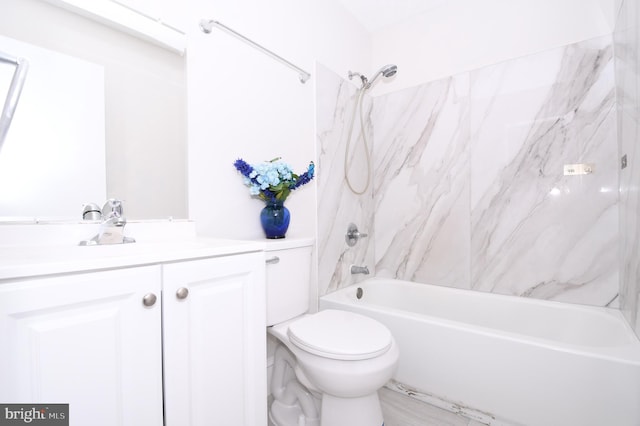 bathroom featuring vanity, bathing tub / shower combination, and toilet