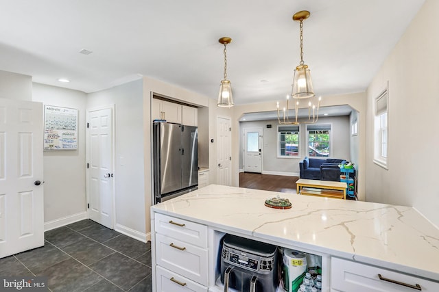 5371 Chillum Pl NE, Washington, DC 20011 - kitchen with freestanding refrigerator, white cabinetry, baseboards, light stone counters, and recessed lighting