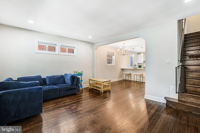 5371 Chillum Pl NE, Washington, DC 20011 - living area featuring stairway, a chandelier, wood finished floors, arched walkways, and recessed lighting