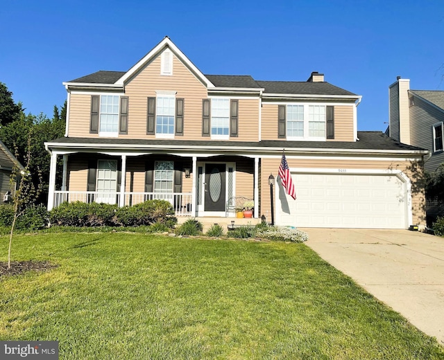 9033 Allington Manor Cir W, Frederick, MD 21703 - view of front of property with a chimney, driveway, covered porch, an attached garage, and a front yard