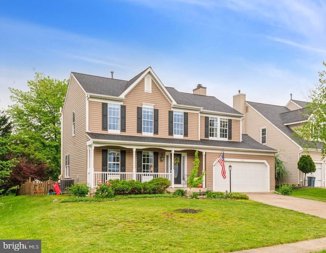 9033 Allington Manor Cir W, Frederick, MD 21703 - view of front facade with covered porch, driveway, a chimney, and a front lawn
