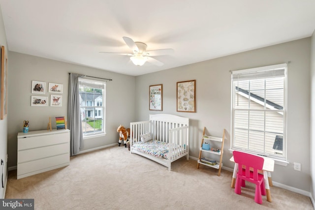 9033 Allington Manor Cir W, Frederick, MD 21703 - bedroom with a nursery area, carpet, baseboards, and a ceiling fan