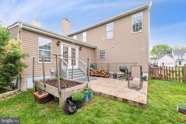 9033 Allington Manor Cir W, Frederick, MD 21703 - back of house with fence, french doors, a yard, a patio, and a chimney